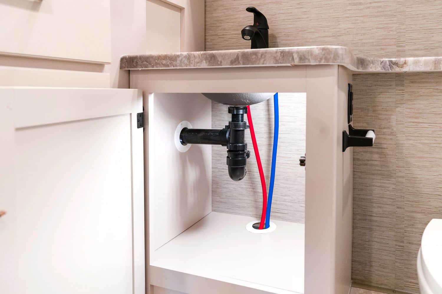 RV plumbing under sink repair maintenance